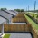 aerial shot of fenced in backyards for each home