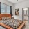 carpeted bedroom with private bathroom