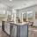 kitchen island with sink next to dining area